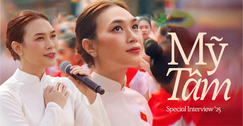 Mỹ Tâm trong tà áo dài trắng và cờ đỏ sao vàng